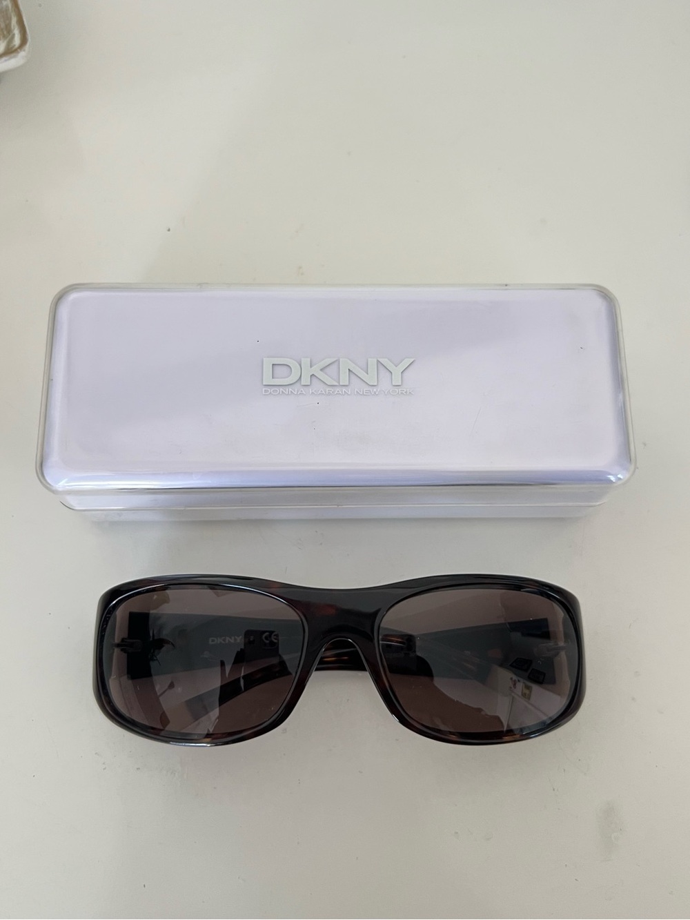 DKNY Brown Sunglasses with Dark Tinted Lenses